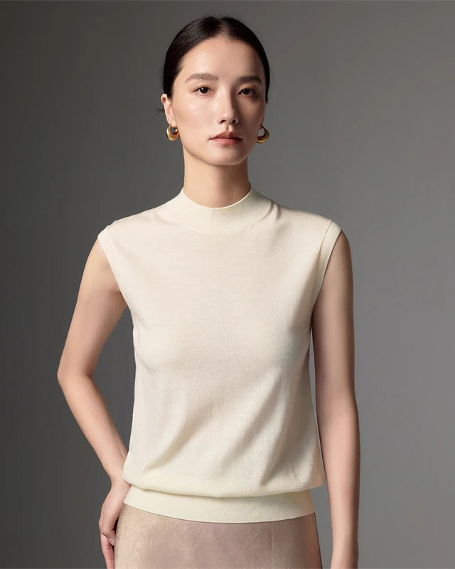Lightweight worsted wool mock neck sleeveless vest. Machine washable, regular fit, slight stretch.