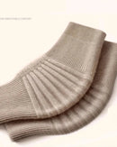 Knitted cashmere knee warmer sleeves. Solid, soft, and warm — a cosy autumn winter knee support for women. Available in M–XXL by body weight.