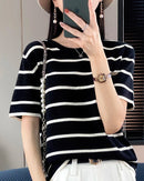 Women's Patchwork Cotton Knit Crew Neck Tee. Soft cotton knit, patchwork detail, relaxed fit.