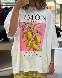 Women's lemon botanical print T-shirt featuring a vintage citrus graphic, breathable cotton knit, and an oversized fit for cottagecore garden and campus wear.