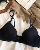 Seamless front-closure push-up bra for women, made of polyester and spandex, with adjustable convertible straps and wire-free support for all-day comfort.