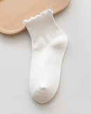 Cotton ruffle ankle socks. Breathable knit, feminine frilly cuff, lightweight comfort. One size fits most. 