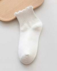 Cotton ruffle ankle socks. Breathable knit, feminine frilly cuff, lightweight comfort. One size fits most. 