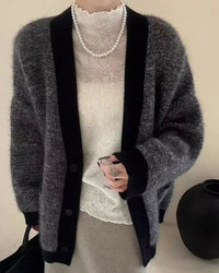 Defined by a V neckline and an easy, loose fit, this knitted cardigan offers a considered approach to everyday layering.