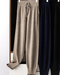 Women's Merino Wool high-waist knit trousers featuring a relaxed bloomer cut and thick knit texture, crafted from pure wool for breathable warmth and elegant layering in air-conditioned indoor settings.