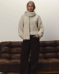 A Loose Soft V-Neck Sweater With A Scarf