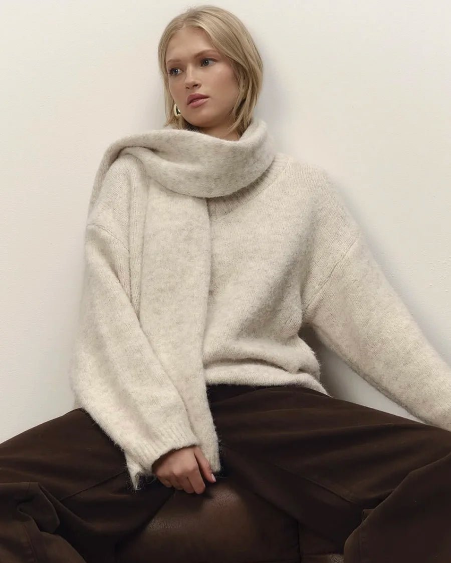 A Loose Soft V-Neck Sweater With A Scarf