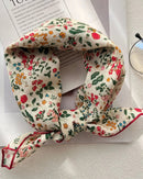 A small square scarf with a fine floral print and light smooth fabric, designed to knot at the neck, tie as a headband, or accent a bag.