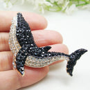 Stylish retro style dolphin brooch in silver tone, sleek marine animal pin with flowing curves and polished finish, perfect for adding nautical charm.