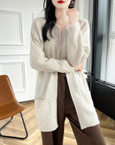 A merino wool long cardigan featuring a playful dot pattern, an open front, and a seamless knit for a soft, elegant, and cozy layer.