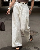 Women's high-waisted wide-leg cotton trousers featuring breathable twill fabric, a relaxed straight fit, and side pockets for a polished silhouette in all seasons.