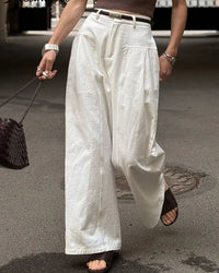 Women's high-waisted wide-leg cotton trousers featuring breathable twill fabric, a relaxed straight fit, and side pockets for a polished silhouette in all seasons.