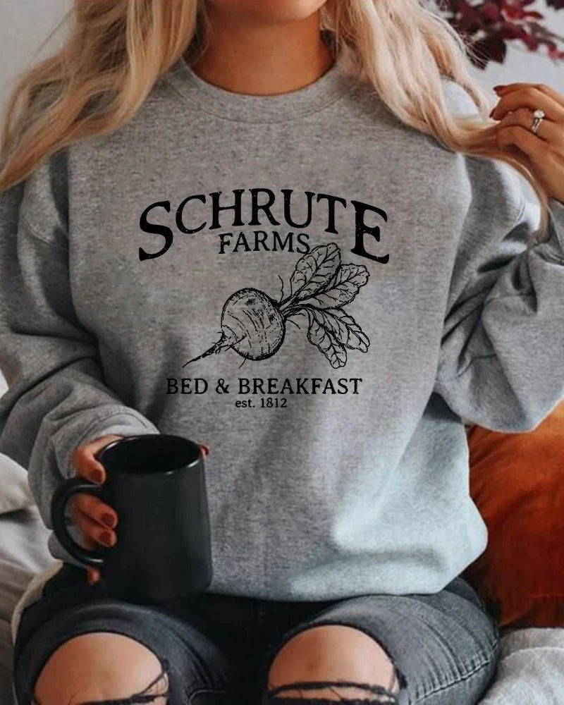 Women's long sleeve pullover sweatshirt featuring a cotton blend fabric with slight stretch, standard thickness, and a printed Bed & Breakfast logo for casual office wear.