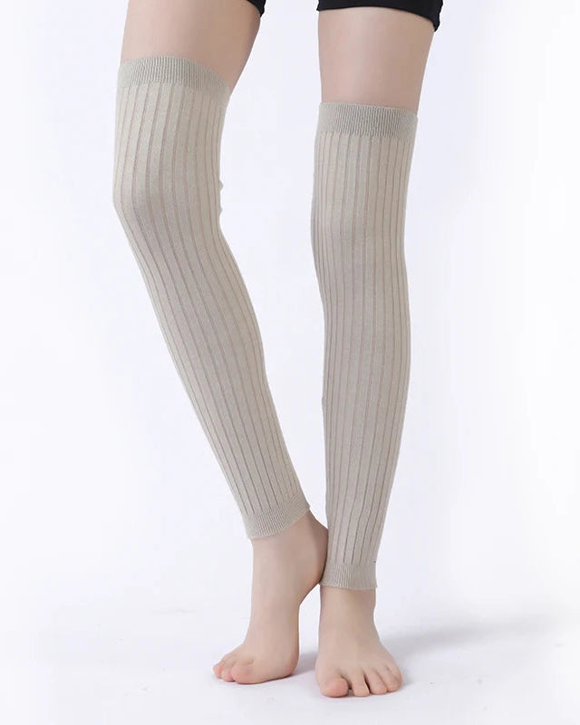 Women's Cotton knit leg warmers featuring a sculpted ruffle trim, high-elastic fit, and 50cm knee-high silhouette, perfect for office warmth or city commutes.