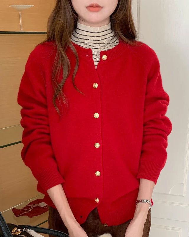 Premium wool button cardigan — a refined knit outerwear piece featuring golden buttons and a classic O-neckline. Timeless style for autumn and winter layering.