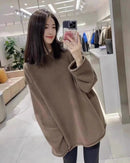 A mid-length cashmere crewneck sweater with crew neck, thick knit and loose fit, designed for a cozy winter layering look that pairs from sneakers to boots.
