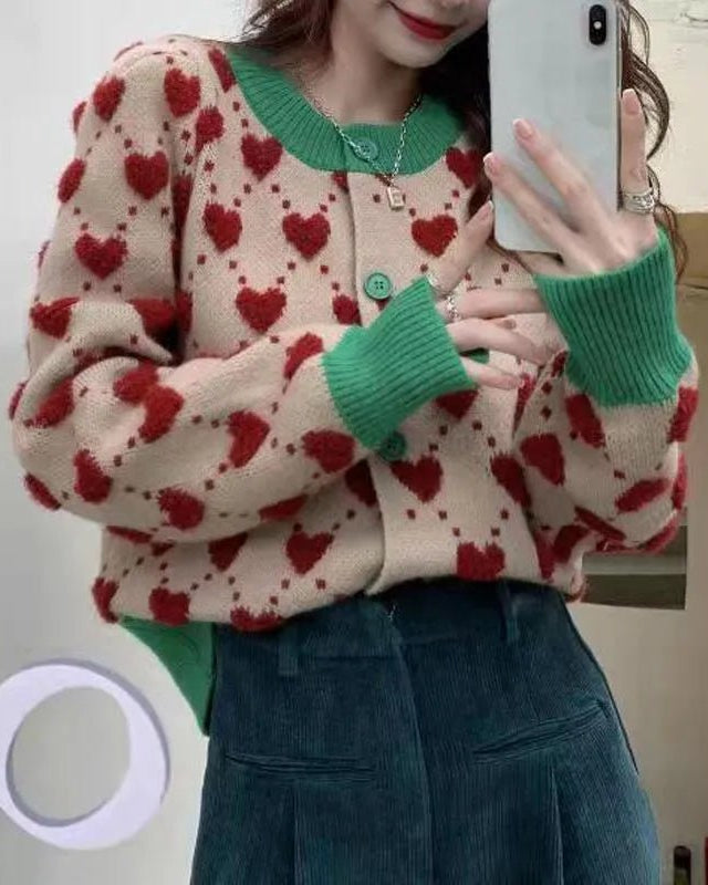 Women's Knitted short cardigan featuring an ugly sweater heart detail and diamond decoration, crafted from a soft polyester-viscose-nylon blend that delivers cozy chic comfort for indoor climate control or breezy evening outings.