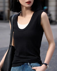 Women's wool-blend crew-neck knitted vest featuring a breathable fabric and elongated silhouette, designed for effortless layering from spring commute to summer resort wear.