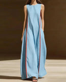 Women's Patchwork pocket sleeveless maxi dress crafted from lightweight polyester, featuring a round neck and A-line silhouette for retro-inspired elegance and comfortable holiday wear in dry warm climates.