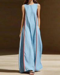 Women's Patchwork pocket sleeveless maxi dress crafted from lightweight polyester, featuring a round neck and A-line silhouette for retro-inspired elegance and comfortable holiday wear in dry warm climates.