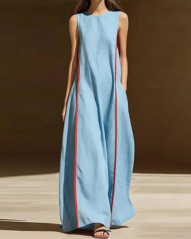Women's Patchwork pocket sleeveless maxi dress crafted from lightweight polyester, featuring a round neck and A-line silhouette for retro-inspired elegance and comfortable holiday wear in dry warm climates.