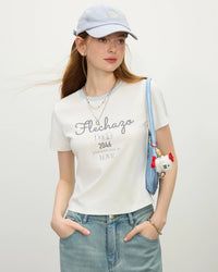 Women's white knit sports t-shirt with crew neck and .Short-length cotton spandex blend top perfect for summer workouts and casual wear.