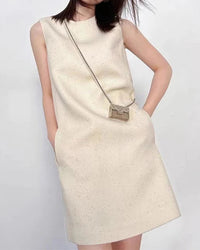 Women’s sleeveless strappy sequined mini dress with shimmering all-over detail—glamorous statement piece for evening parties, New Year celebrations or cocktail events.