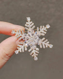Snowflake rhinestone brooch pins, micro-encrusted zircon stones, gold-tone setting —festive sparkle for winter coats or holiday sweaters.