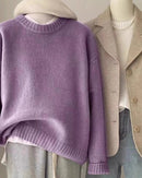 Luxury cashmere sweater for women with a distinctive waxy hand-feel, designed in a timeless O-neck silhouette ideal for layering during fall and winter seasons.