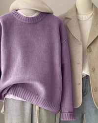 Luxury cashmere sweater for women with a distinctive waxy hand-feel, designed in a timeless O-neck silhouette ideal for layering during fall and winter seasons.