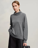 Luxurious women's solid color turtleneck sweater featuring loose relaxed fit and long sleeves, crafted from premium wool blend knit fabric with medium stretch, perfect cozy pullover for winter casual and office wear.