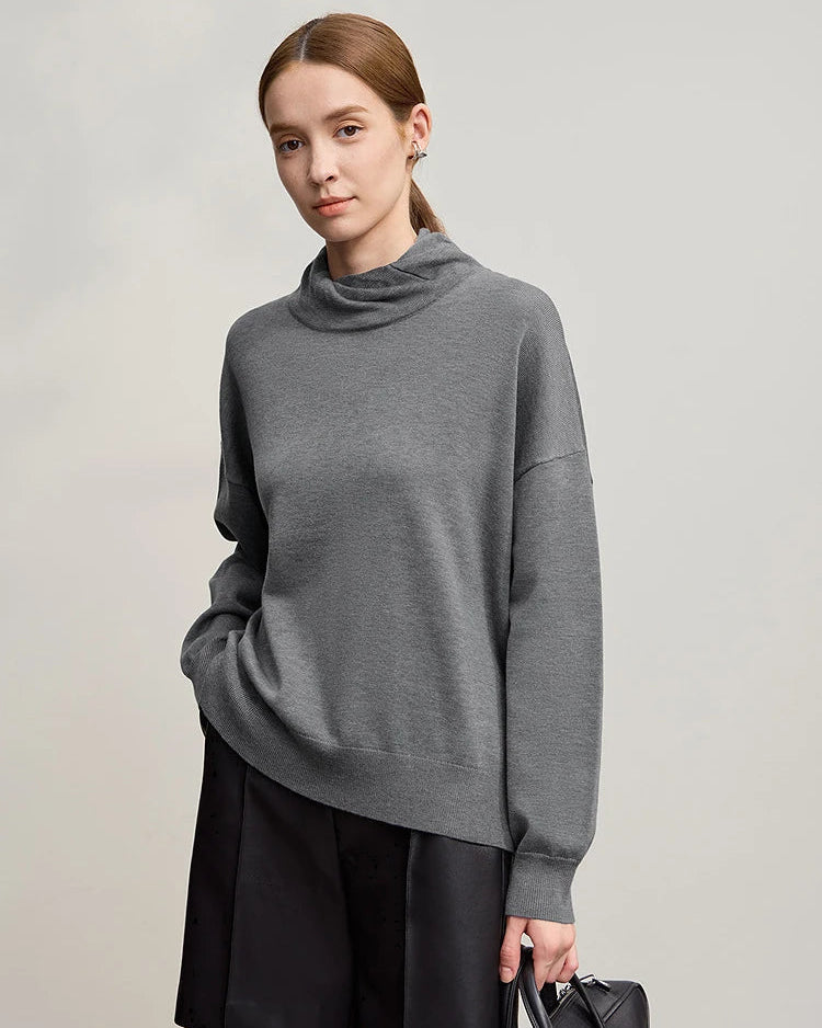 Luxurious women's solid color turtleneck sweater featuring loose relaxed fit and long sleeves, crafted from premium wool blend knit fabric with medium stretch, perfect cozy pullover for winter casual and office wear.