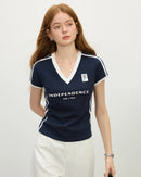 Flattering navy cropped tee with deep V-neck and sporty white piping. Soft breathable cotton knit with subtle stretch moves with you—perfect for gym sessions, casual outings, or streetwear layering.