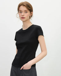 Flattering slim-fit tee featuring straight shoulder seams that create elegant silhouette. Soft breathable women's top ideal for casual office days or weekend outings.