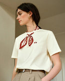 Women's cream cotton t-shirt with detachable floral scarf tie at neckline and cherry embroidery detail, short sleeve O-neck knit top for spring summer casual wear.