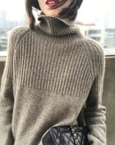 Woman heading to work in a Thick Turtleneck Wool Sweater, 19.5-micron 100 % Merino rib drapes like jersey—your polished yet cozy 45-65 °F fall-to-spring commuter layer