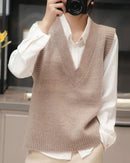 Woman layering the V-Neck Wool Knitted Sweater Vest, 19.5-micron 100 % Merino rib and relaxed drop-shoulders give nautical polish—your wind-proof 45-65 °F fall-through-spring essential.