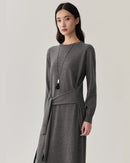 Women’s winter wool crew-neck knit dress in midi length, relaxed straight cut,  merino wool rib, long sleeves, ribbed cuffs & hem, cold-weather office or holiday outfit.