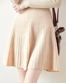 Women’s merino-wool Korean-style mini skirt with small-umbrella silhouette and high waist—playful autumn layer for campus days, weekend markets or coffee dates.