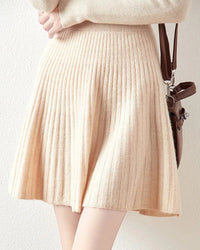 Women’s merino-wool Korean-style mini skirt with small-umbrella silhouette and high waist—playful autumn layer for campus days, weekend markets or coffee dates.
