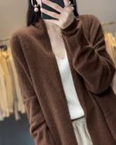 Women’s merino-wool long-sleeve cardigan with relaxed fit and solid color—soft, breathable layer for spring-autumn office days, weekend layering or travel-day chic .