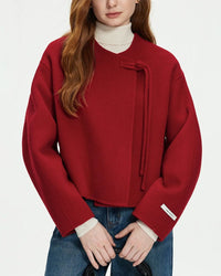 Woman Commuting in a short double-sided coat, 18-inch length and raw-edge seams deliver minimalist structure while locking in warmth for 35-55 °F fall days.