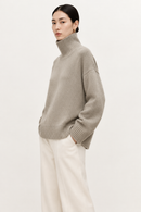 Oatmeal cashmere turtleneck sweater side view