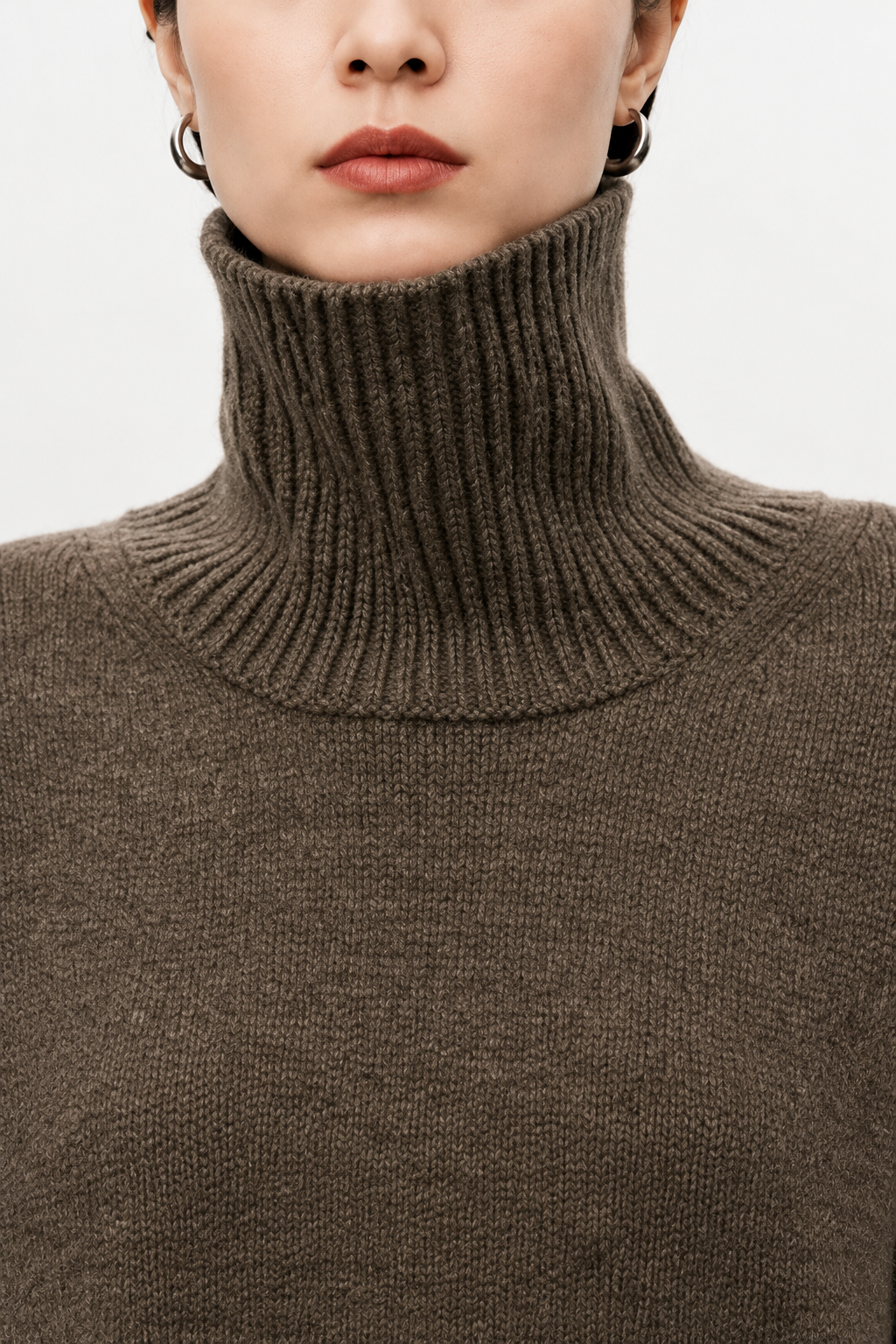 Brown cashmere turtleneck sweater collar detail