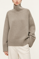 Oatmeal cashmere turtleneck sweater cuff and hem detail