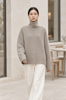 Oatmeal cashmere turtleneck sweater lifestyle view