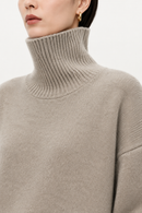 Oatmeal cashmere turtleneck sweater collar detail