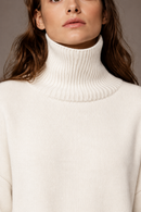White cashmere turtleneck sweater collar detail