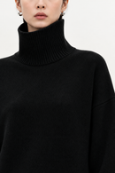 Black cashmere turtleneck sweater collar detail